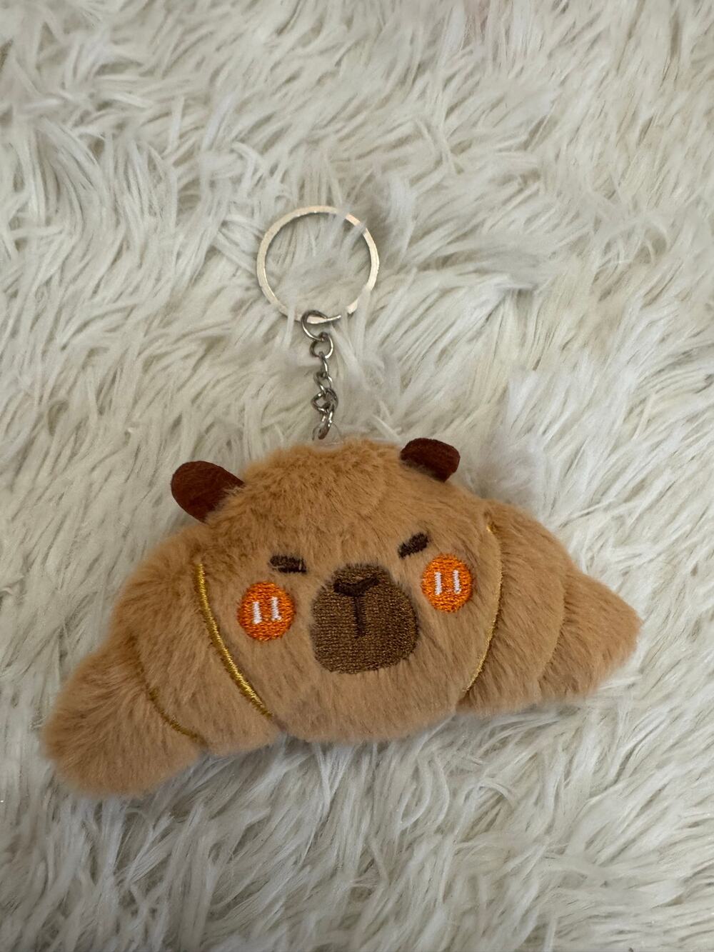 Capybara croissant plush keychain with embroidered  face and orange cheeks